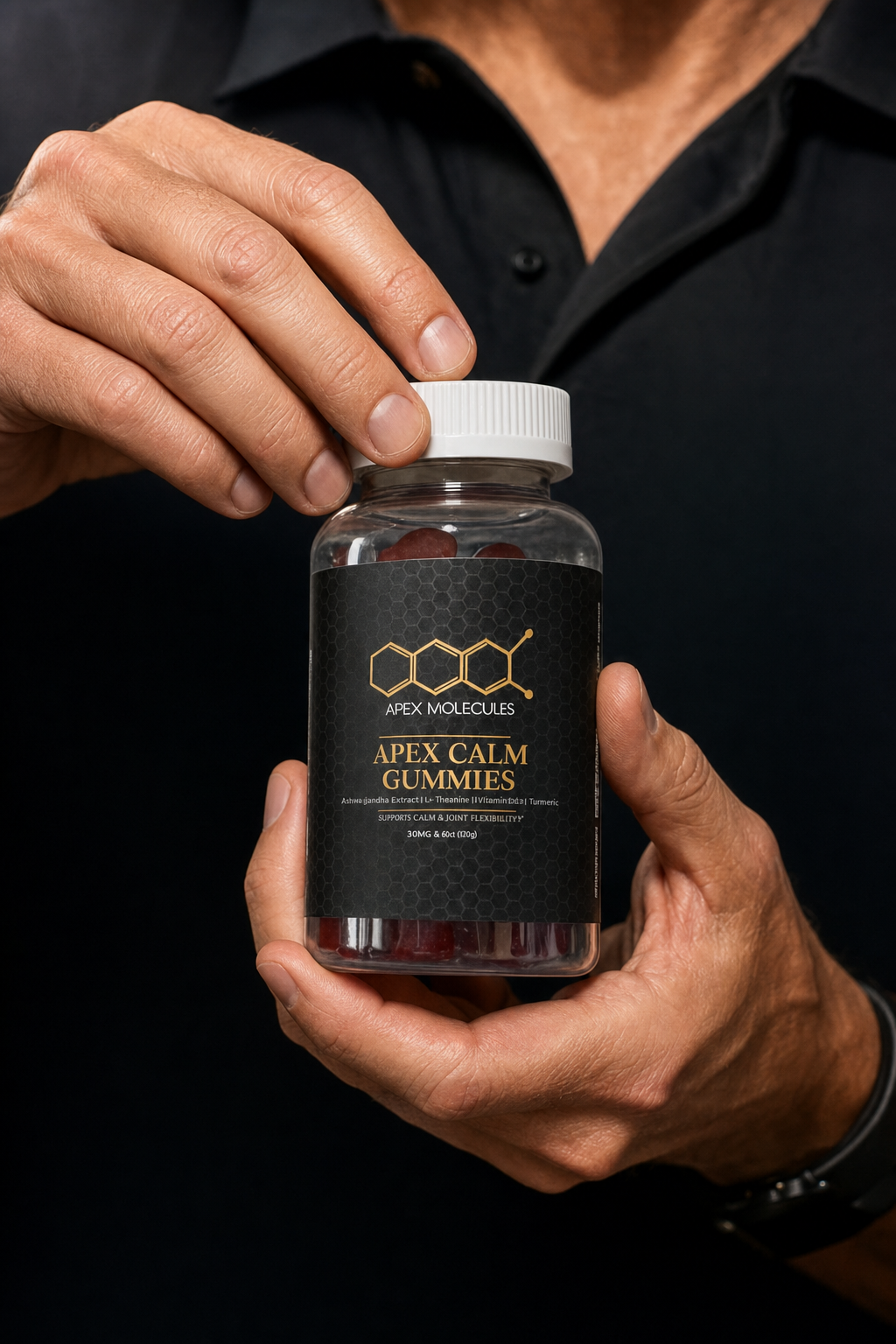 Hands holding a bottle of Apex Calm Gummies